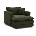 Sillón de pana verde oscuro con cojín decorativo
