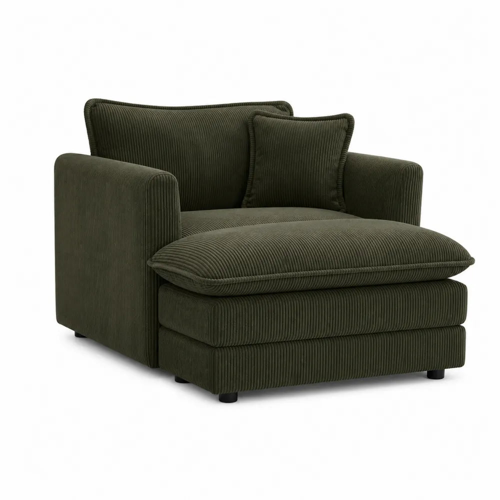 Sillón de pana verde oscuro con cojín decorativo