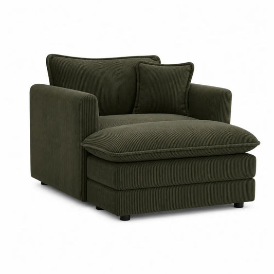 Sillón de pana verde oscuro con cojín decorativo